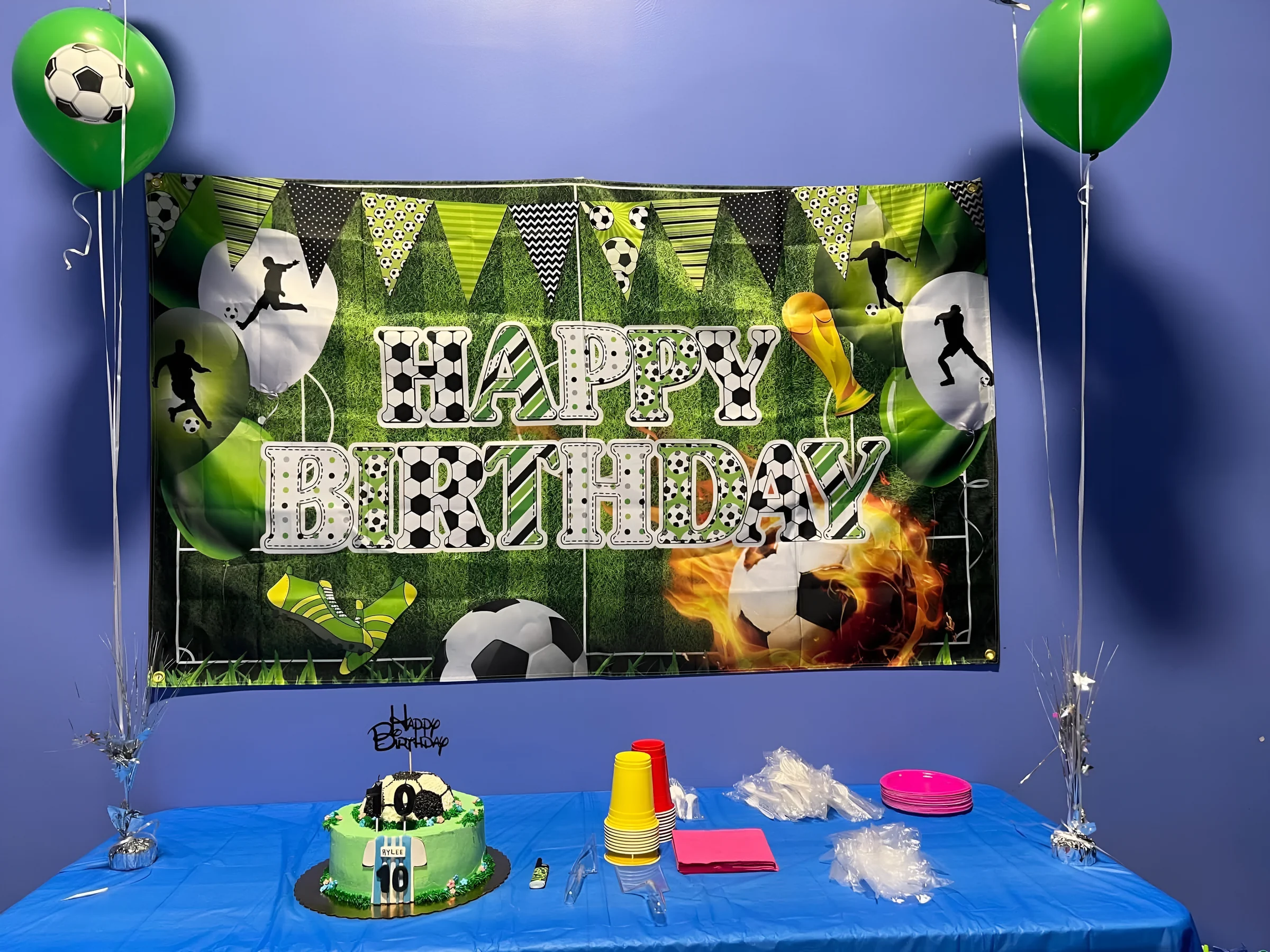 Birthday party room with Happy Birthday backdrop and cake at Nova Adventure Park Cincinnati