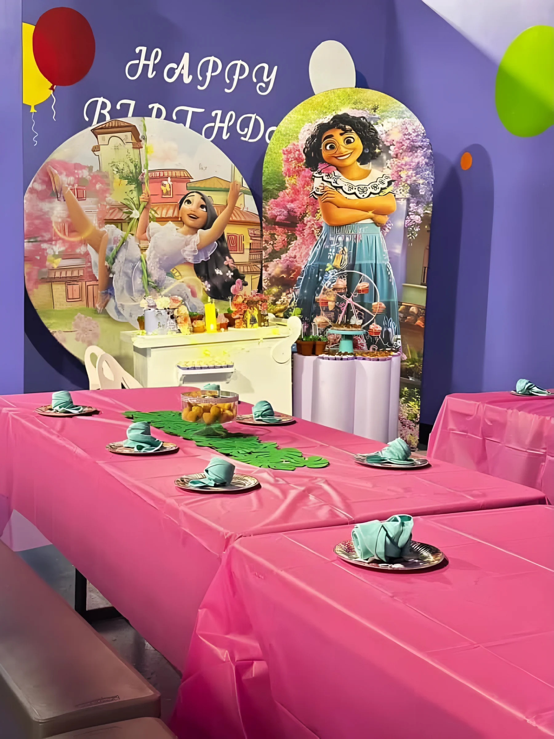Party table with pink tablecloth and themed backdrop at Nova Adventure Park Cincinnati
