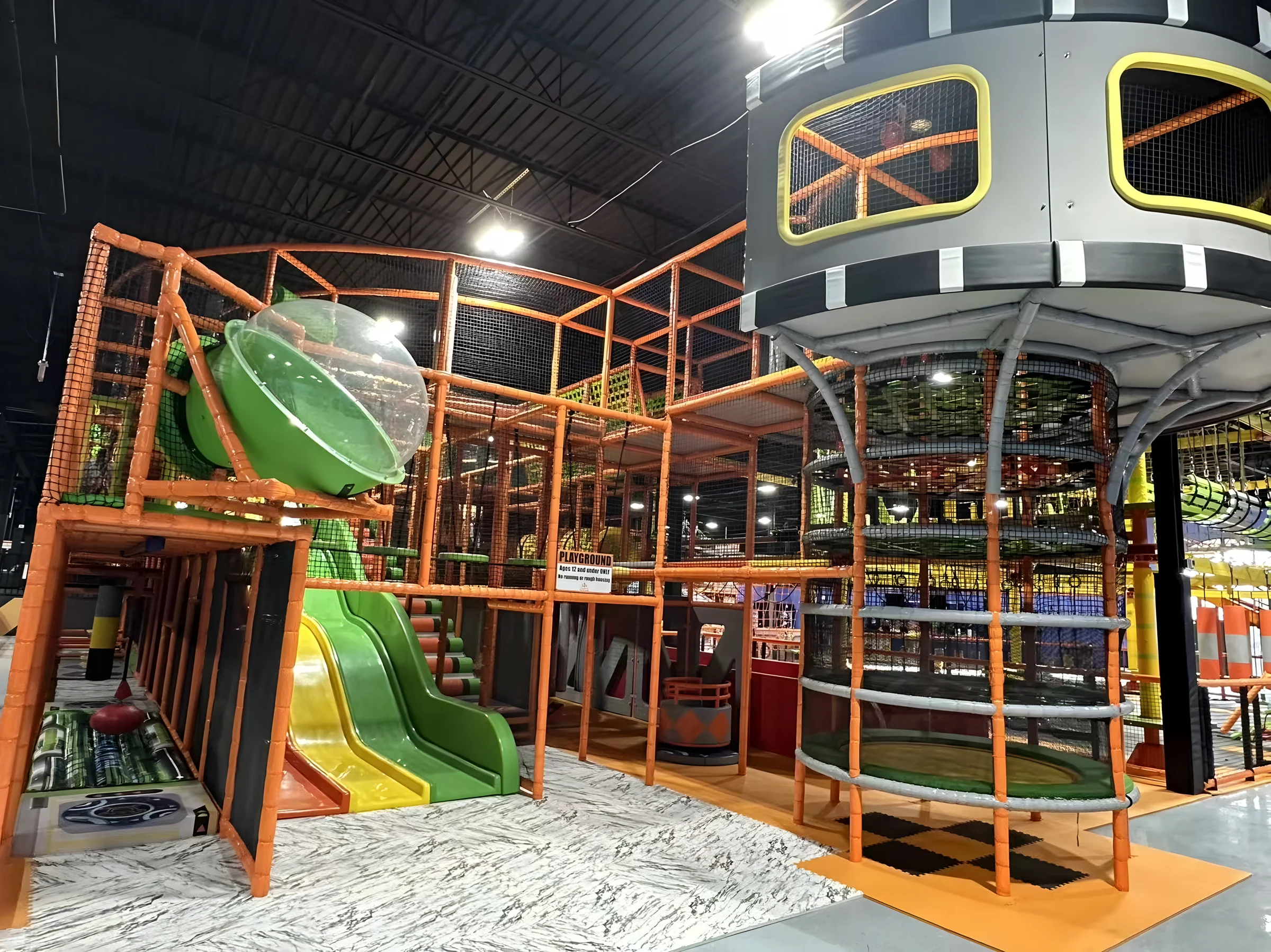 Kids indoor playground with slides and spaceship tower at Nova Adventure Park Cincinnati