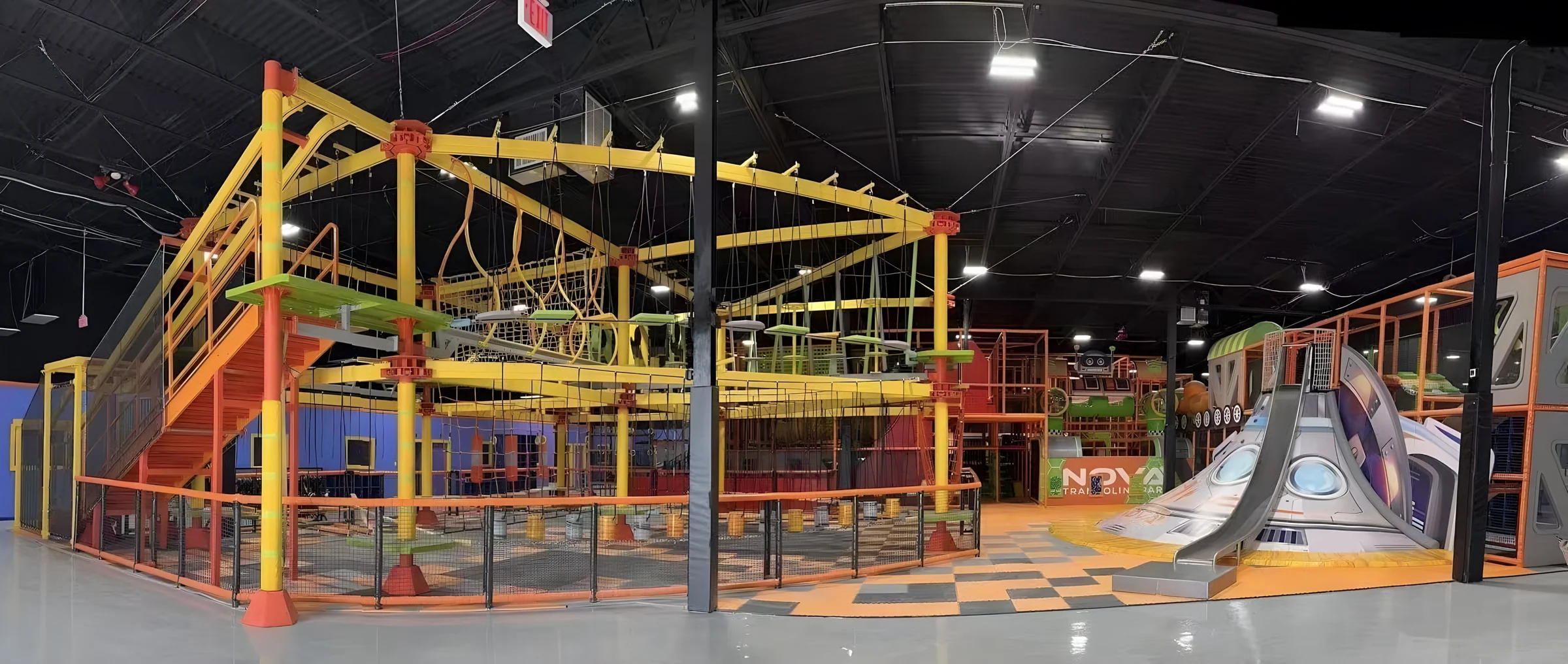 Yellow ropes course and spaceship slide at Nova Adventure Park Cincinnati